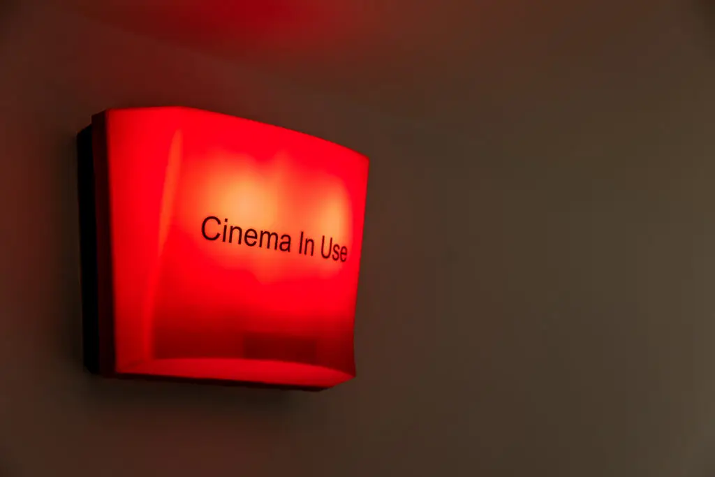 Home cinema installation with projector surround sound and luxury seating